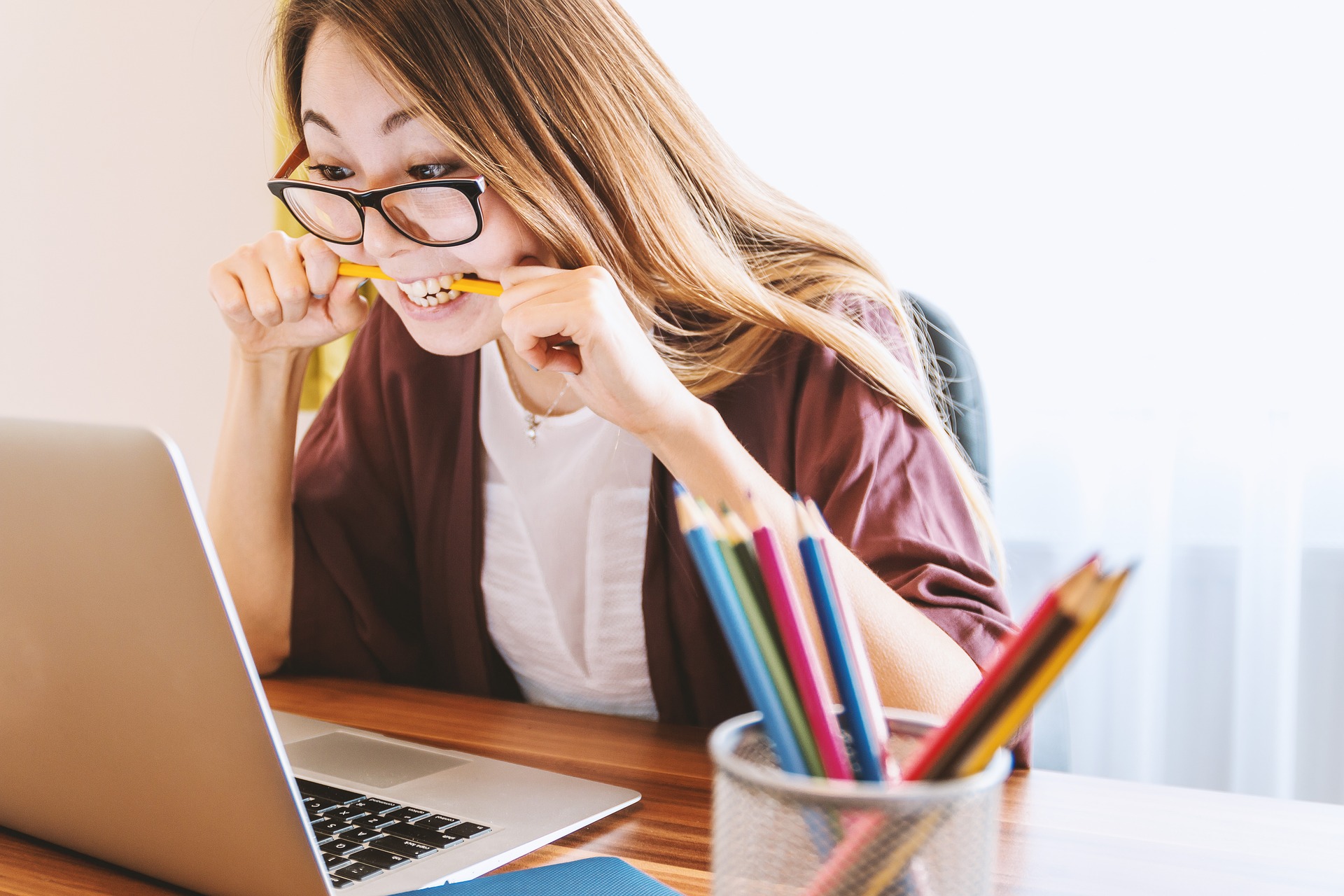 image shows a student writing their dissertation