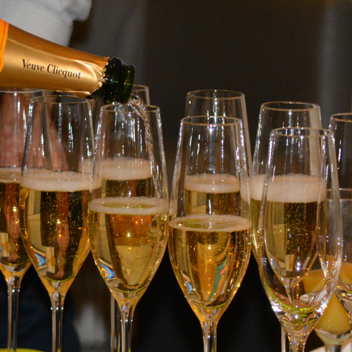 picture shows glasses of champagne being poured in order to celebrate Sheffield grad week