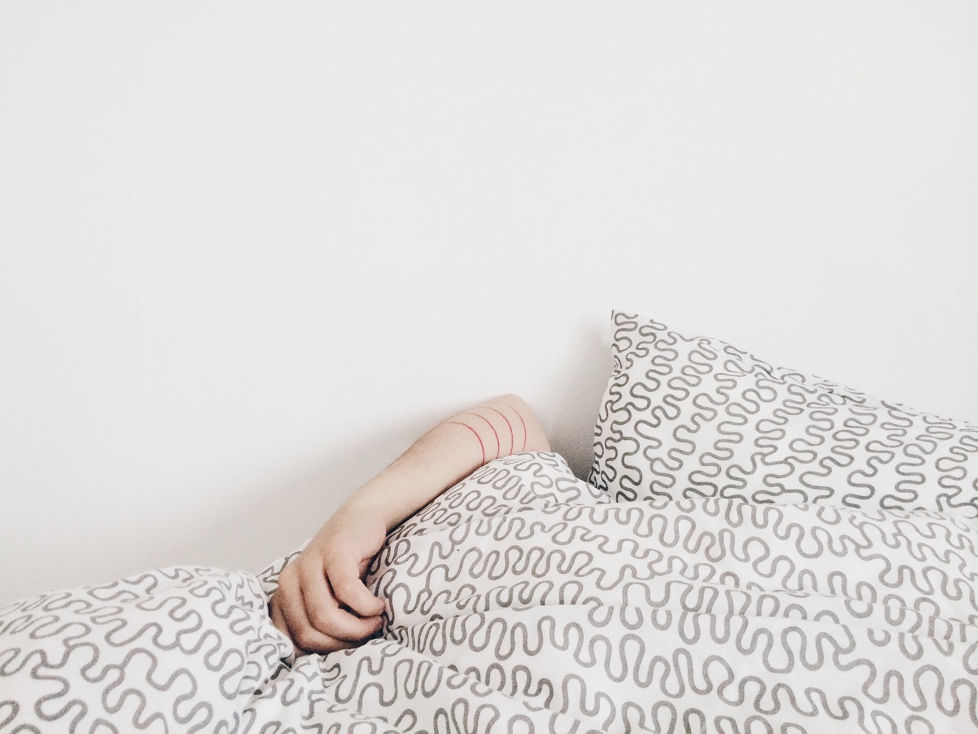 image shows someone in bed sleeping