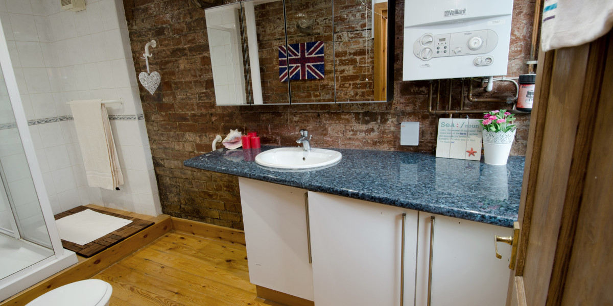 Bathroom with freestanding shower and vanity unit