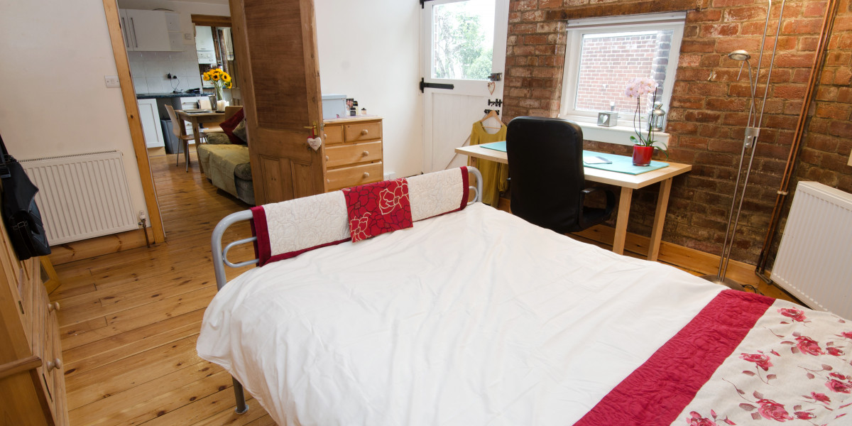 Bedroom 2 boasts exposed brickwork
