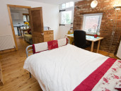 Bedroom 2 boasts exposed brickwork - Thumbnail