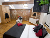 Bedroom with hardwood floors and exposed beams - Thumbnail