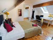 Bedroom 3 with original beam and hardwood floors - Thumbnail
