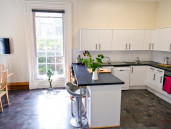 Communal kitchen and breakfast bar in shared student house in Sheffield - Thumbnail