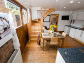 Spacious kitchen with seating area and dining table - Thumbnail