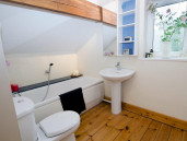 Bath and shower in The Stables. - Thumbnail