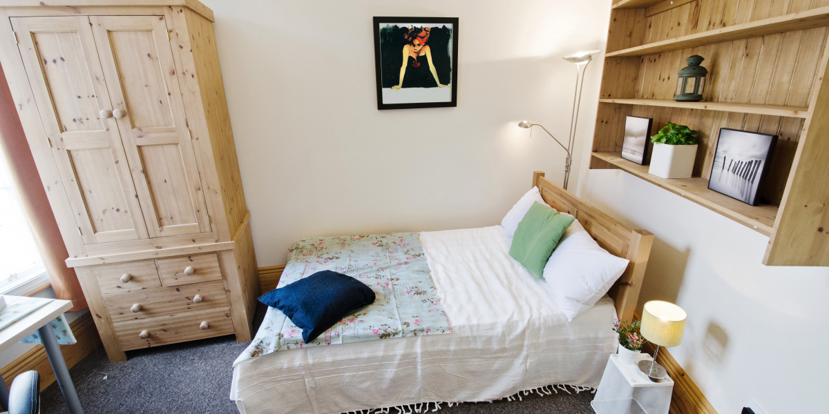 Double bed with double pine wardrobe, perfect for students to rent in Sheffield.