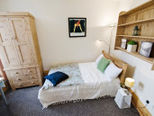 Double bed with double pine wardrobe, perfect for students to rent in Sheffield. - Thumbnail