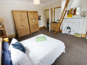 double bed and original features in large student room to rent in Sheffield - Thumbnail
